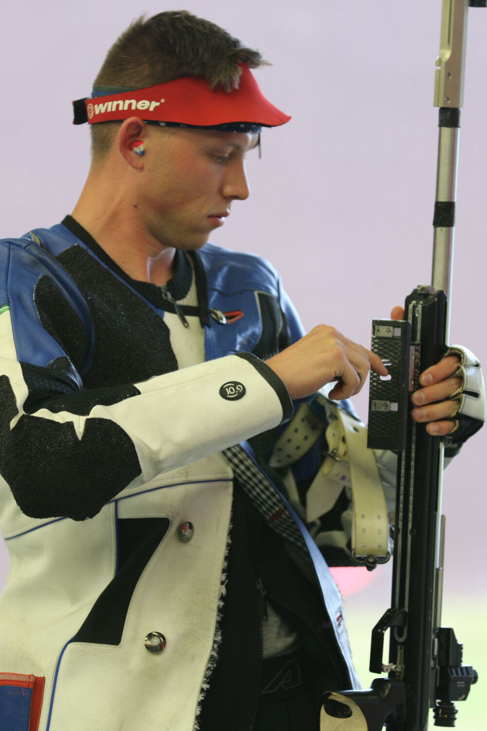 US Army Sergeant Patrick Sunderman examines his rifle during Olympic Trials in Fort Benning, Georgia, on May 26, 2021.